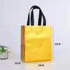 Bolsa Pequeña de Regalo Navideño Transfronteriza con Sarja Láser Película de Aluminio Colorida Película Láser Bolsa No Tejida Personalizada
