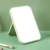Espejo de maquillaje 3D de plástico de color sólido, espejo de tocador 3D portátil, espejo pequeño plegable de alta definición para escritorio de dormitorio de estudiante