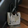 Bolsa de Lona Rayada de Venta Caliente Transfronteriza Nueva para Mujer Bolso Tote de Clase de Gran Capacidad Bolso Tote de Hombro Estilo Coreano para Viajes al Trabajo