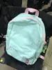 Mochila simples e fresca de cor sólida 2023 nova mochila leve para estudantes bolsa de mão casual da moda que combina com tudo para mulheres