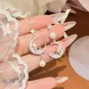 2026 Novos Brincos de Franja Lua Rosa Francesa Mais Vendidos para Mulheres Design de Nicho Temperamento Elegante Brinco Versátil