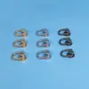 Venta al por mayor de fábrica con anillo cabeza de monje clavo para pezón accesorios de hardware para equipaje accesorios para funda de teléfono móvil cabeza de monje giratoria con letra D