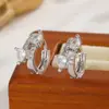 Elegantes y sofisticados pendientes de botón de circonita para mujer, pendientes de moda transfronterizos europeos y americanos, pendientes simples y únicos