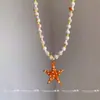 Colar pingente de estrela-do-mar laranja estilo resort boêmio, nicho de luxo leve, acessório de corrente para clavícula que valoriza o colo para mulheres