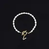 Pulsera de Moda de Venta Caliente Transfronteriza 2026 con Diamantes y 26 Letras, Pulsera de Perlas de Imitación Ovaladas, Disponible para Venta al por Mayor para Mujeres