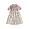 Vestido de niña estilo francés vintage con fruncidos y cuello alto, nuevo modelo de verano 2026, suave vestido de princesa infantil floral de manga corta