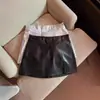 Falda corta de línea A, de cintura alta, sexy, con abertura, falda de piel, nuevo estilo primavera/otoño 2026, falda de talla grande para mujer, para chicas con curvas, ajustada al cuerpo
