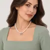 Collar con colgante de lazo de perla de vidrio Shijia de alta gama de nicho de lujo ligero para mujer, nuevo estilo elegante con cadena de clavícula de cuentas