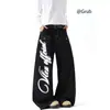 Jeans de estilo americano de patchwork deconstruido con dobladillo curvo lavado para hombre y mujer, pantalones de pierna ancha sueltos de estilo callejero con revestimiento y estampado, modelo nuevo