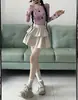 Falda de Cuero Sexy Atractiva para Mujer Otoño Estilo Coreano 2025 Nueva Cintura Alta Ajustada Corta Abullonada Falda Pastel