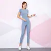 Suministro directo transfronterizo conjunto de dos piezas para gimnasio y yoga para mujer traje deportivo casual para niñas camiseta deportiva moderna mujer