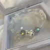 Diseño original ópalo natural cristal de fresa pulsera de la suerte simple lujo ligero diseño de nicho hilo elástico