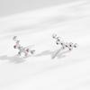 Aretes pequeños de tuerca de plata esterlina S925 con circonita arcoíris, aretes femeninos de moda europea y americana que combinan con todo, alas de ángel, aretes de venta caliente transfronterizos