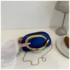 2025 Bolso de Mano Nuevo Decoración Metálica en la Muñeca Personalidad Transfronteriza Europea y Americana Bolso de Noche Bolso de Hombro Cruzado