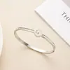 Pulsera Abierta de Acero de Titanio Zirconia Corazón de Amor Gota de Agua Venta Caliente Cruzada Sensación de Alta Gama Galvanizado al Vacío No se Descolora Anillo de Cierre