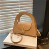 Bolso de nicho transfronterizo para mujer, nuevo bolso de hombro semi-redondo, versátil para el trabajo, bolso cruzado con hebilla de candado vintage, bolso de moda
