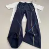 Calça de Moletom Cropped Azul Marinho Estilo Americano com Barra Curva para Homens, Temporada de Outono, Costura Exposta, Calça Flare com Caimento, Calça Esportiva Casual High Street