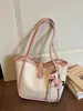 Bolsas de mano para mujer transfronterizas, nuevo modelo 2026, bolso de hombro y bandolera de alta gama a la moda para mujer, bolso de mano simple para el día a día, bolso tipo cubo