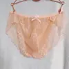 Cueca masculina de renda, sexy, plus size, em tela, preta e rosa, sedutora, transparente, com bolsa fina.