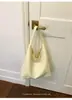 Fábrica de origen de comercio exterior transfronterizo estilo universitario retro 2026 nuevo bolso de hombro tote Maillard