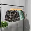 Shorts de pata de gallo para hombre de marca casual de lujo, nuevo estilo verano 2025, shorts de playa rectos holgados de cuatro puntos, pantalones casuales retro