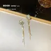 Pendientes de perla de flor blanca explosiva temperamento de alta gama lujo ligero nuevos pendientes de pétalo pendientes delicados venta al por mayor