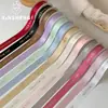 Nuevo Producto de CintaCinta de Poliéster Doble Cara con Estampado Dorado en Inglés Xinyou - Cinta de Satén Floral de Alta Calidad para Ramos de Flores y Regalos