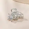 Aleación de concha europea y americana tamaño pequeño clip de rasguño cabeza trasera Clip de tiburón metálico forma de estrella de mar pinza para el pelo accesorios para el cabello de nicho para mujeres