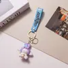 Lindo Colgante Llavero Sanrio Dibujo Animado Kuromi Perro de Orejas Grandes Colgante para Bolsa Ciudad de Arcade Pequeño Regalo Al Por Mayor