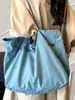 Bolsa Tote Nova Verão 2025 Estilo Coreano Nicho Bolsa Grande de Lona para Mulheres Bolsa de Mão Ombro Nicho Ins