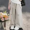 2026 Moda Chique Irregular Ombro a Ombro Manga Curta Camiseta Verão Casual Calça de Perna Larga Conjunto Duas Peças para Meninas