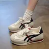 Zapatillas blancas populares estilo retro para mujer, nueva colección otoño 2026, ligeras y versátiles, zapatillas deportivas casuales, estilo de entrenamiento alemán