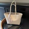 Bolsa Externa Única de Grande Capacidade Feminina 2025 Nova Primavera e Verão Simples Estudante Aula Bolsa de Ombro Trabalho Lazer Bolsa Tote