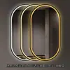 Espejo de baño inteligente ovalado en stock con lijado exterior e iluminación LED translúcida, adecuado para montaje en pared de baño y proyectos hoteleros, con opciones de personalización.