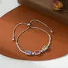 Joyería de Mano Personalizada para Mujer con Baño de Oro Real y Circonita Microincrustada, Diseño de Nicho Geométrico Cubo de Azúcar Pulsera Ajustable con Cierre de Cordón