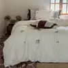 Juego de ropa de cama estilo pastoral con bordado floral, ultra suave y cálido para camas individuales o dobles, hecho de algodón puro con acabado cepillado, disponible en juegos de tres o cuatro piezas, con cálidos diseños en color rosa té.