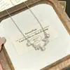 Collar de acero de titanio con colgante de doble mariposa de estilo coreano, de ensueño, para mujer, incrustado con circonita, cadena versátil y lujosa para la clavícula, joyería transfronteriza