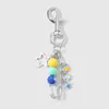 Nuevo Pin Versátil de Moda Dulce y Fresco, Bola de Resina Multicolor, Flor Estrella, Huella de Gato, Estilo Colgante para Llavero DIY