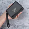 Porta-moedas de Mão Porta-cartões Feminino 2025 Novo Couro Macio com Textura de Lichia Zíper Pequena Bolsa de Moedas Bolsa de Moedas Tendência