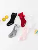 Nuevos calcetines largos de rayas de color sólido para niños y niñas, algodón-poliéster antideslizantes con parte superior de burbuja, calcetines de media pantorrilla con lazo para bebé al por mayor
