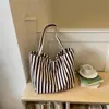 Bolsa de mano a rayas transfronteriza, bolso de hombro de gran capacidad para mujer, bolsa de mensajero simple y versátil, nueva colección de otoño, bolso casual estilo coreano