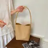 Bolso de axila vintage de alta gama coreano para mujer, verano 2026, cuero suave tejido, bolso de hombro casual tipo cesta