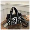 Bolso de Lona para Mujer Otoño e Invierno 2025 Nuevo Estampado de Letras en Contraste Correa de Hombro Colorida Bolso Cruzado de Hombro Manual Casual
