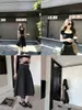 'Falda de Ballet Relajada' - Un estilo ligero, casual y relajado con una cintura ancha y un dobladillo elegante y voluminoso, falda de longitud media