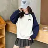 Novedades transfronterizas otoño e invierno sudaderas para niños medianos y grandes tops básicos de manga larga para niñas con estampado de lazo degradado europeo y americano