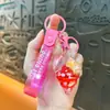 Llavero creativo de concha pequeña con aceite, lindo colgante pequeño de arena movediza líquida, accesorios para bolso, pequeño colgante de regalo, venta al por mayor
