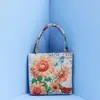 Bolsa de mano bordada con hilo de oro de estilo étnico, bordado a doble cara, bolsa tejida de estilo Harajuku transfronteriza con dibujos animados