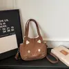 Bolso de hombro casual de dibujos animados nuevo y lindo, bolso cruzado moderno y único, bolso de axila elegante, bolso tote casual para mujer