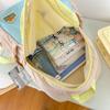 2025 Nova Mochila Escolar de Jardim de Infância Leve Bebê Crianças Mochila de Viagem ao Ar Livre Cor-combinando Estilo Ocidental Mochila Escolar
