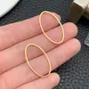 Acero Inoxidable Grande Electrochapado al Vacío Dorado Borde Geométrico Calado Trébol de Cuatro Hojas Símbolo del Infinito Accesorios para Joyería DIY
